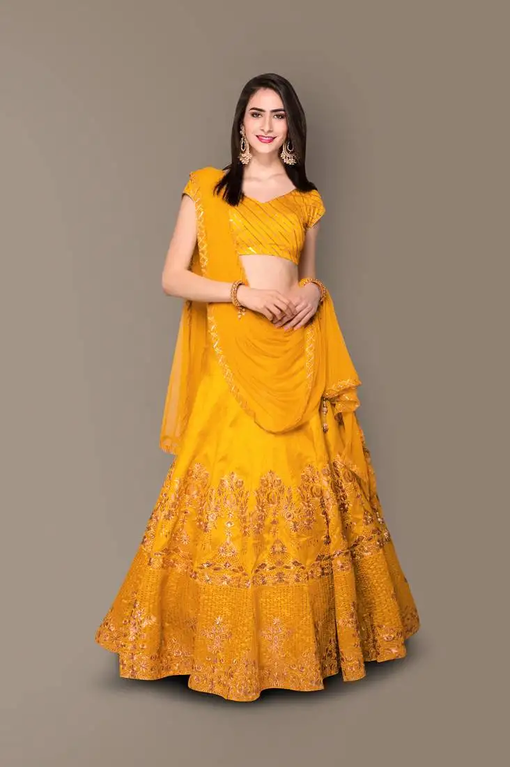 Yellow zari and sequins embroidered with stone work silk semi stitched bridal lehenga