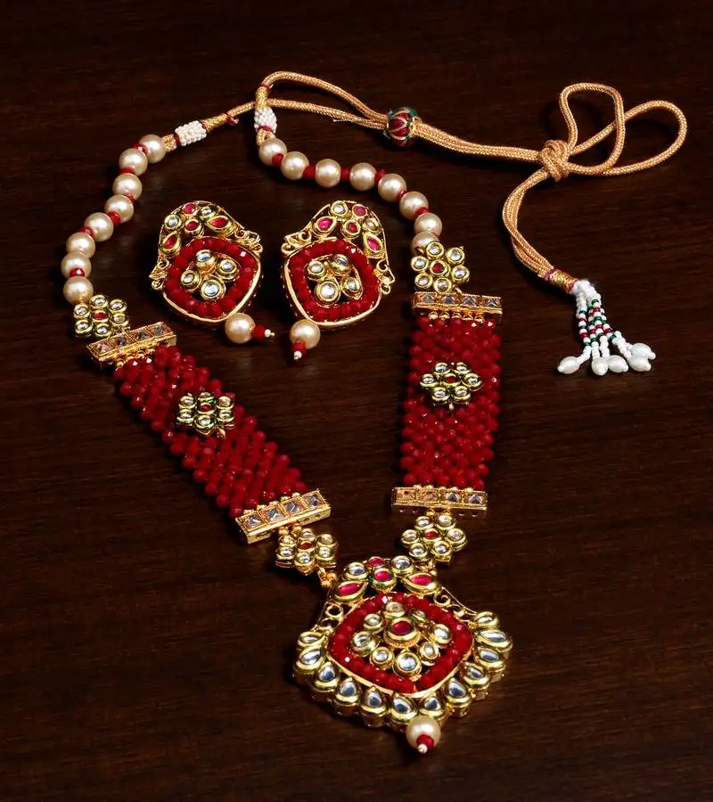 Kundan, pearls and maroon beads embellished designer necklace set 317fnn181
