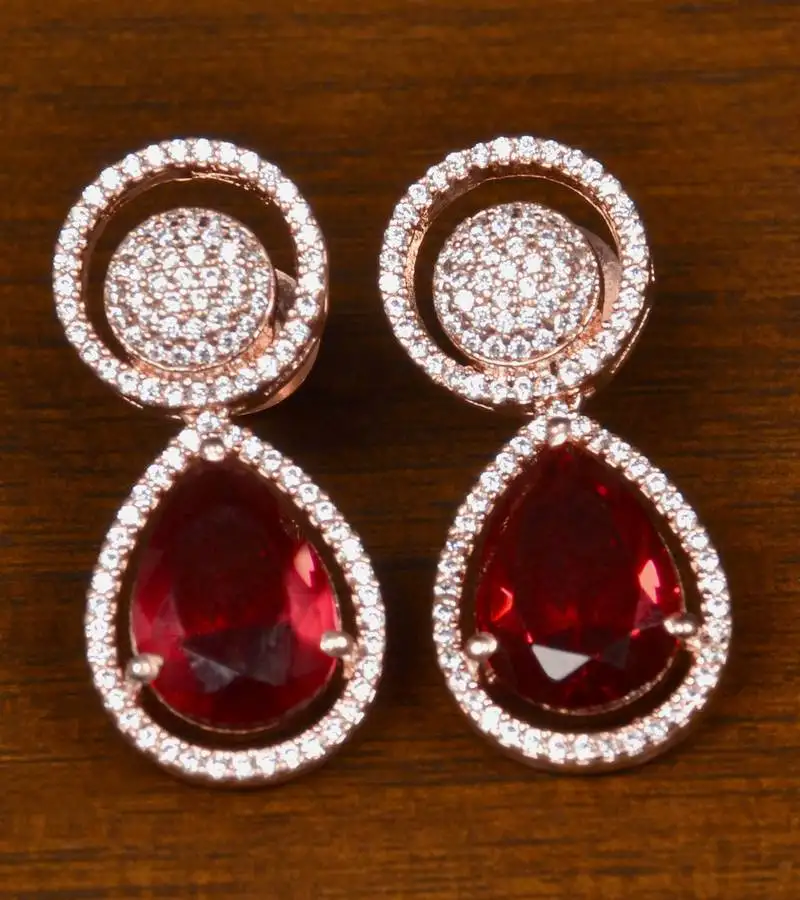 Rose gold plated american diamond and magenta stone embellished earrings 216ed402