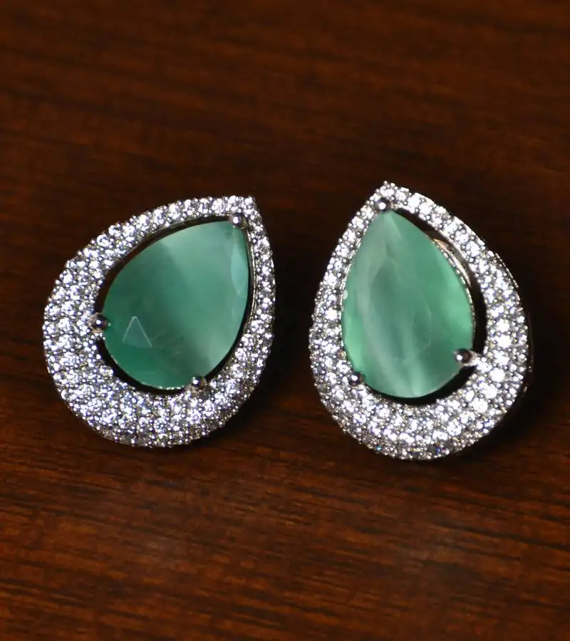 Rhodium plated american diamond and mint stone embellished stud 216ed410