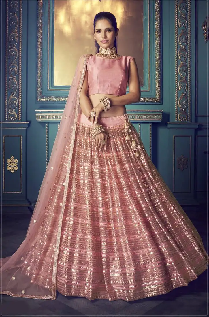 Marvellous pink sequins & thread embroidered net party wear lehenga choli