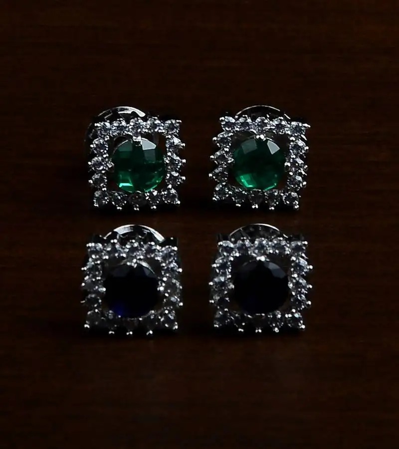 Blue and green stone embellished rhodium plated two pairs of america diamond studs 216ed435