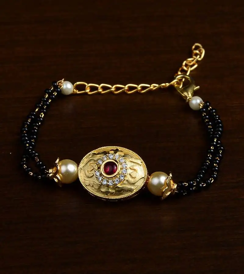 Gold plated pearl and stone embellished mangalsutra bracelet ms16
