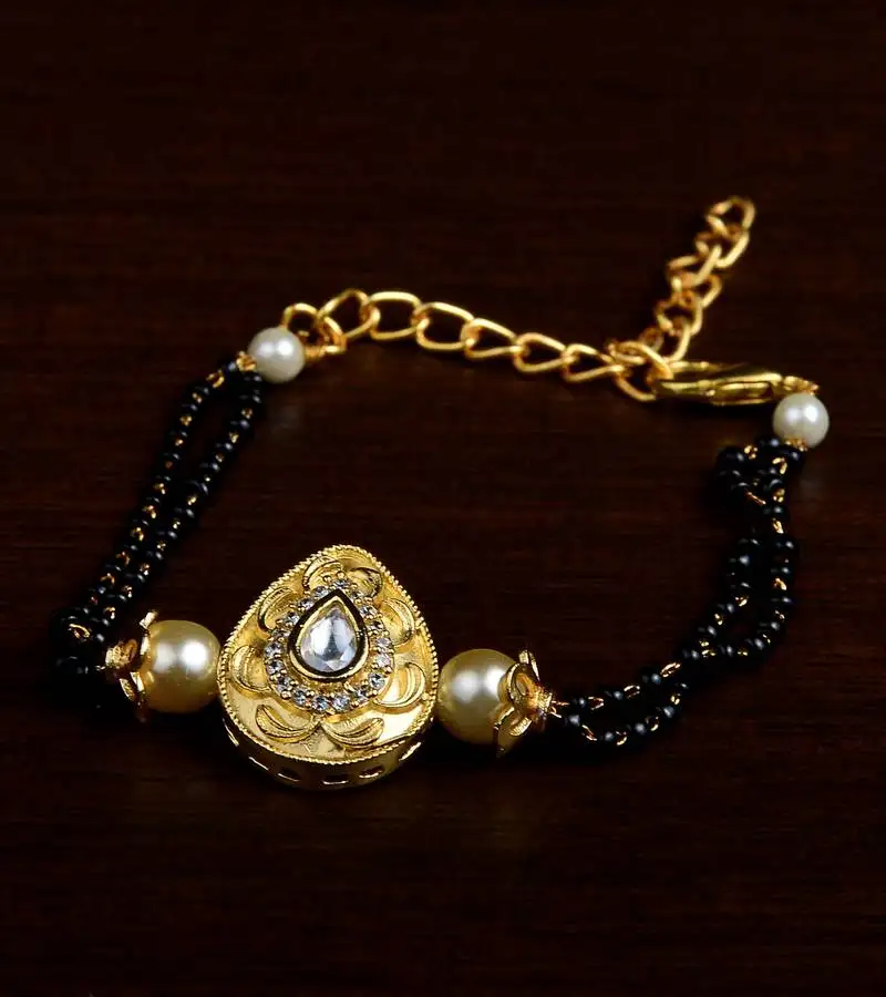 Gold plated pearl and stone embellished mangalsutra bracelet ms18
