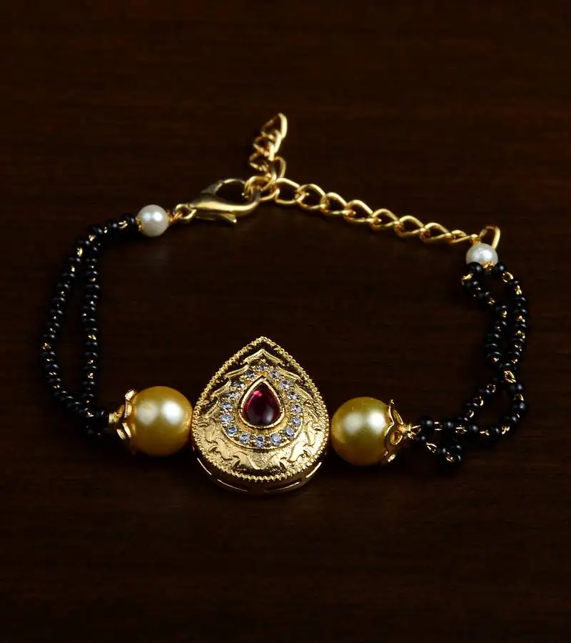 Gold plated pearl and stone embellished mangalsutra bracelet ms17