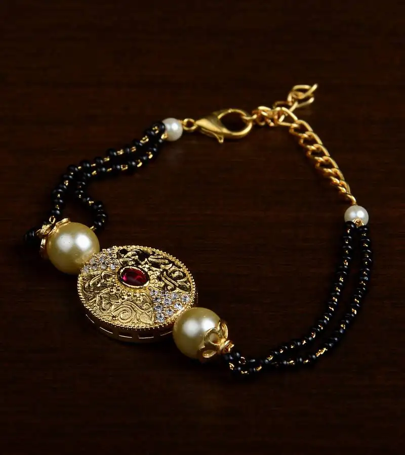 Gold plated pearl and stone embellished mangalsutra bracelet ms21