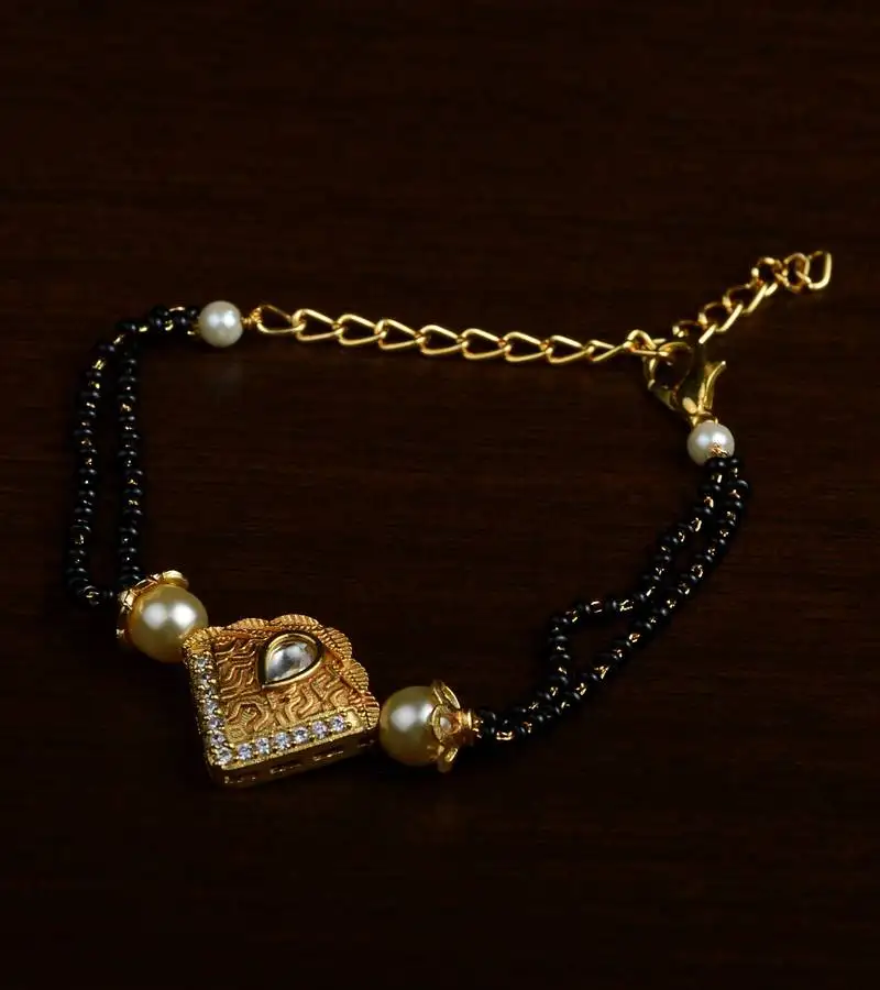 Gold plated pearl and stone embellished mangalsutra bracelet ms22
