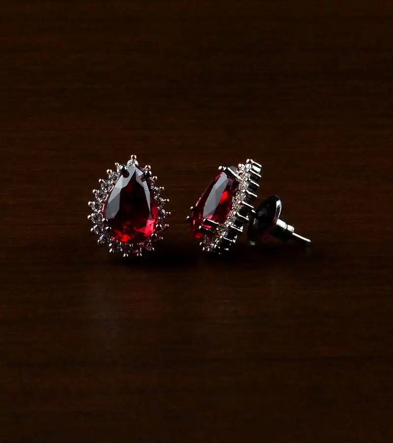 Rose and black plated hydro ruby stone embellished american diamond earrings 216ed487