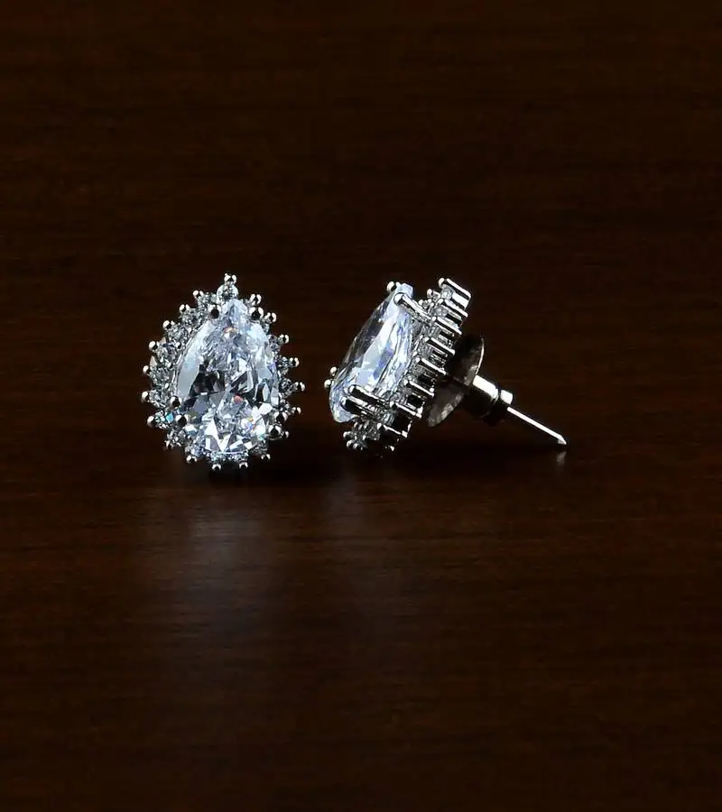 Rhodium plated white stone embellished american diamond earrings 216ed496