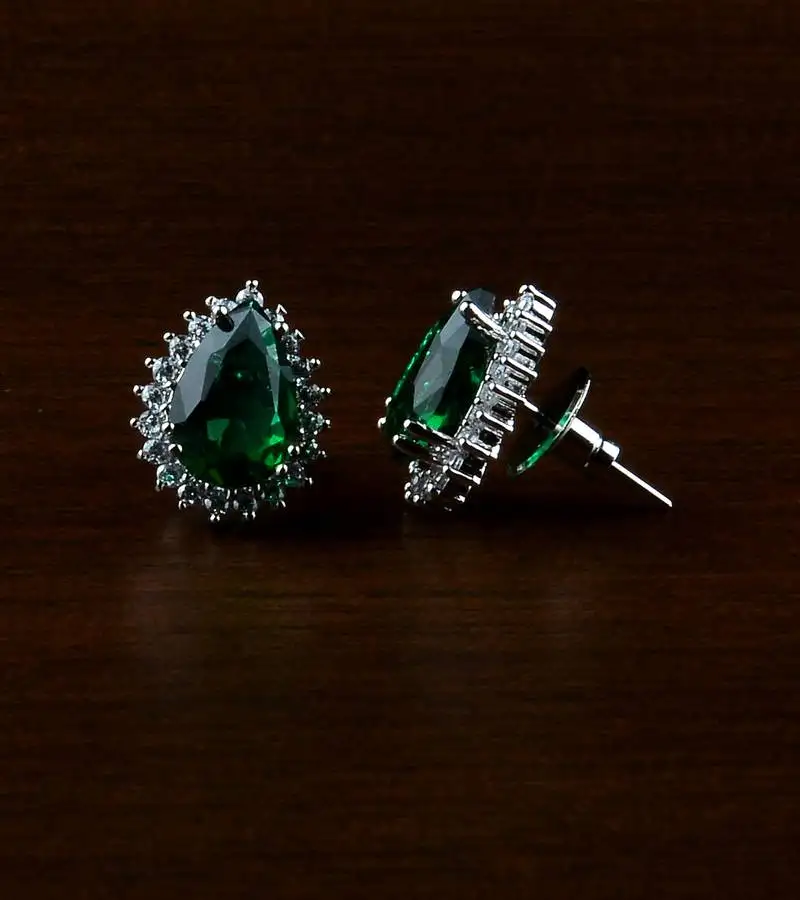 Rhodium plated green stone embellished american diamond earrings 216ed499