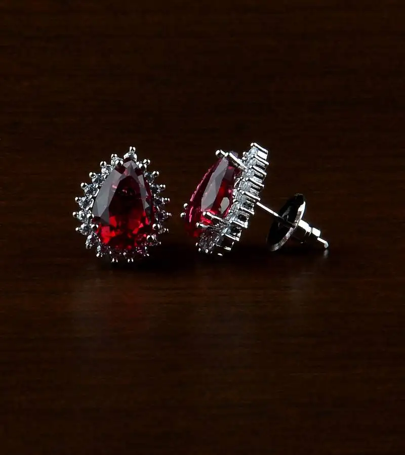 Rhodium plated hydro ruby stone embellished american diamond earrings 216ed500