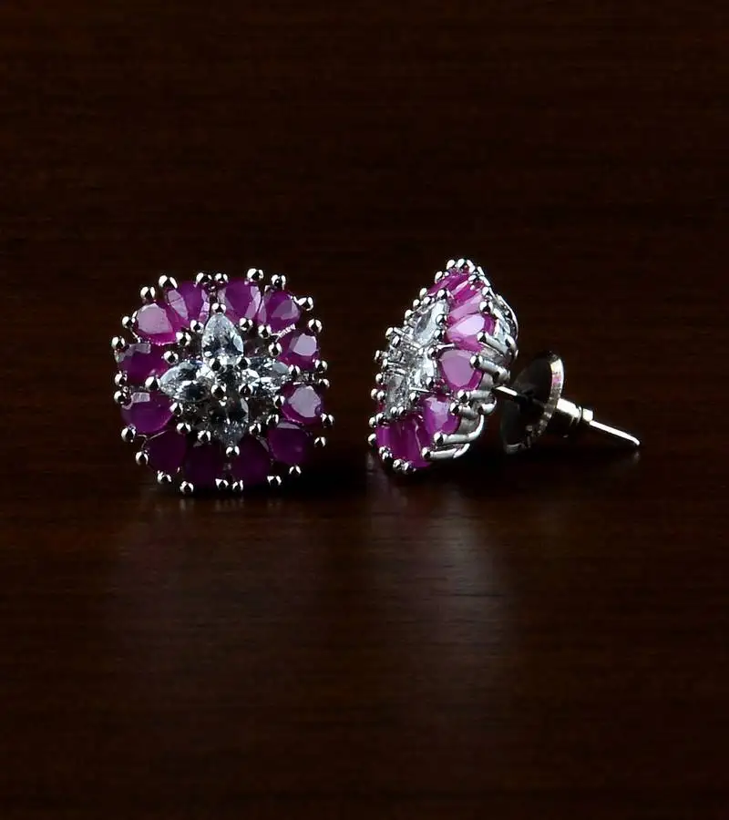 Rhodium plated ruby stone embellished american diamond earrings 216ed505
