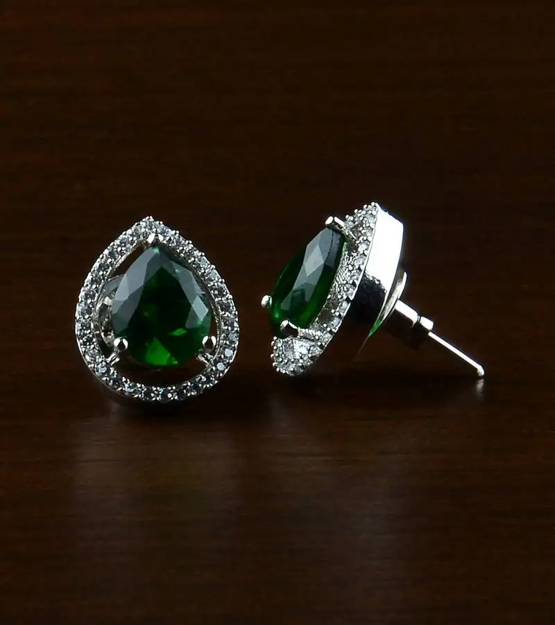 Rhodium plated green stone embellished american diamond earrings 216ed520