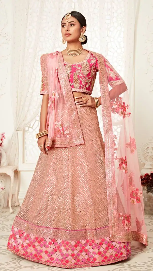 Hypnotizing pink zari sequins and thread embroidered designer net lehenga choli