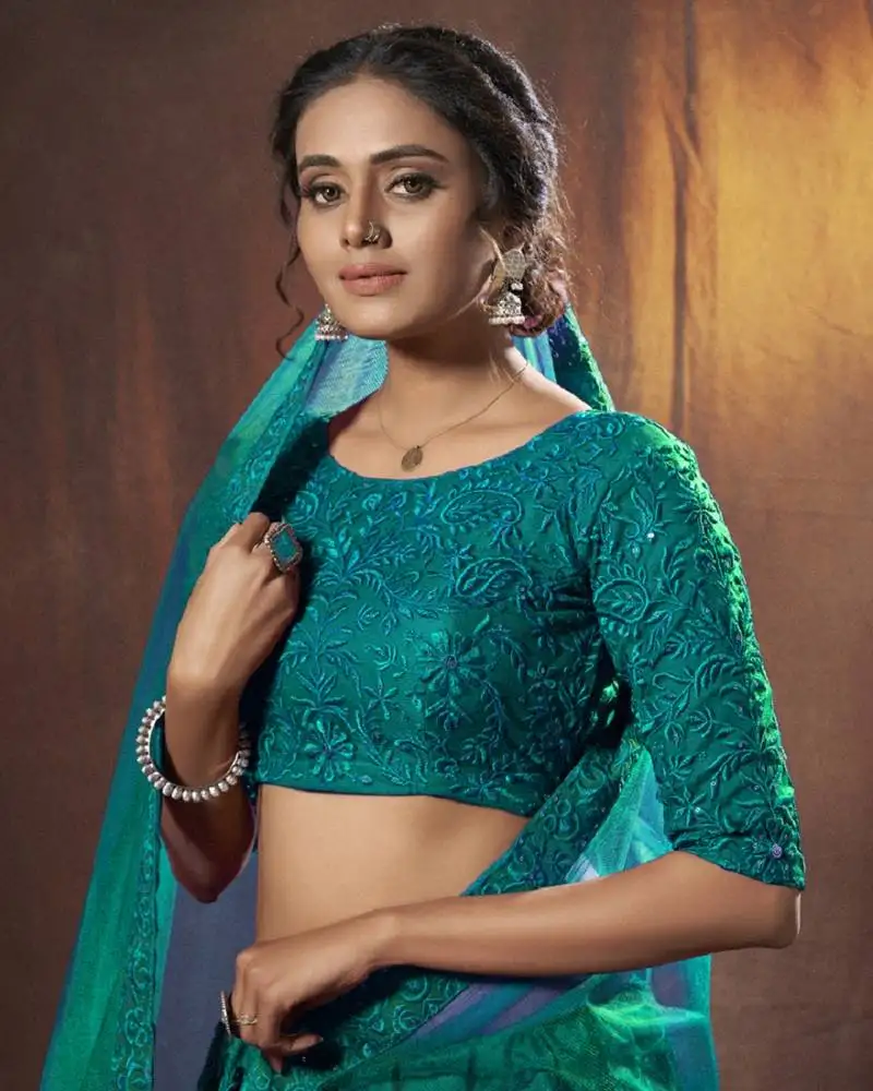 Dark-green thread embroidery net semi stitched bridal lehenga