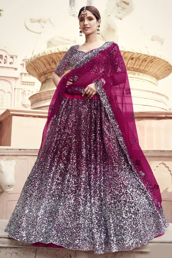 Glamorous wine colored sequins embroidered net fabric lehenga choli for wedding