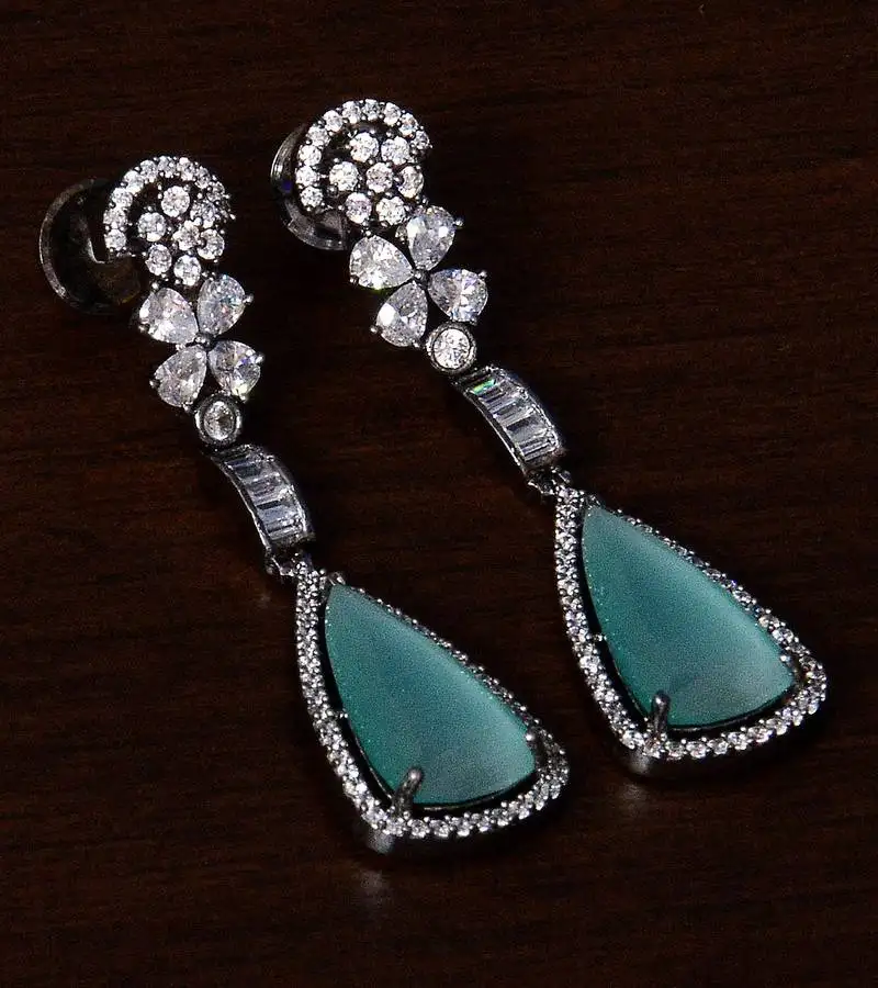 Black gold plated sea green stone and american diamond embellished designer danglers 216ed237