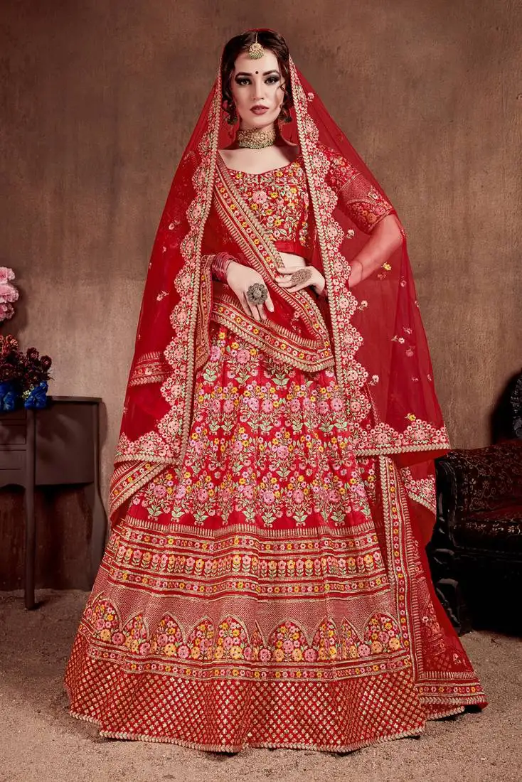 Desiring carmine red colored fine embroidered designer semi stitched lehenga choli for bride