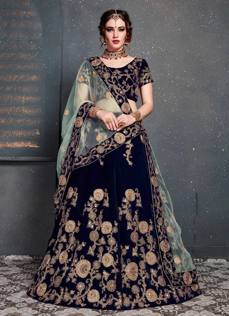 Dark-blue colored zari embroidered wedding bridal velvet lehenga choli with dupatta