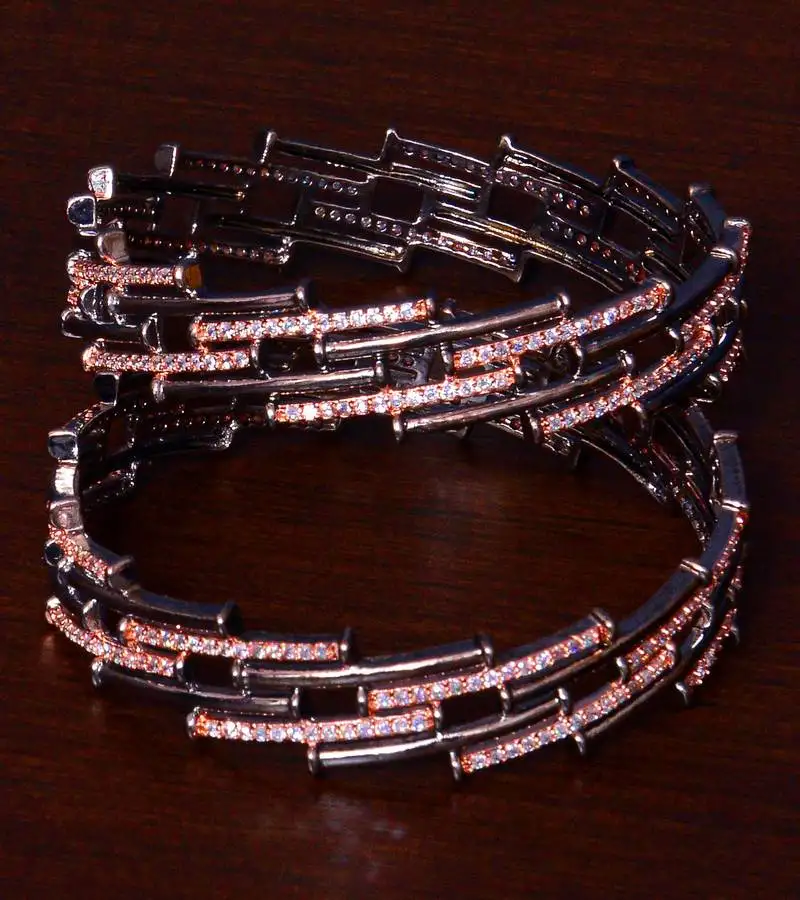Black cum rose gold plated aaa cz stone embellished designer bangles bd404